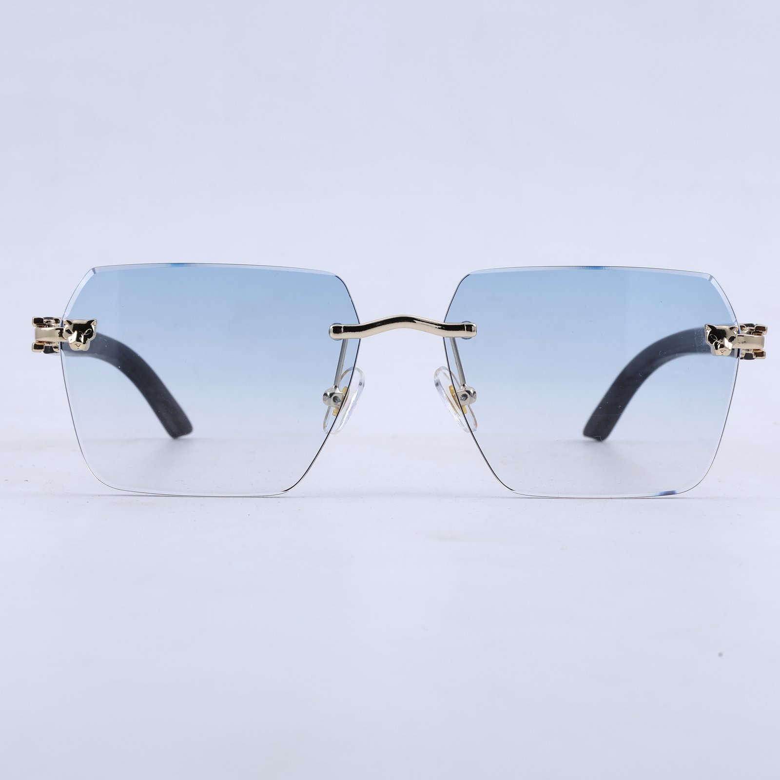OG Arctic Phantom | Luxury Rimless Ice Blue Geometric Sunglasses with Gold Skull Temples